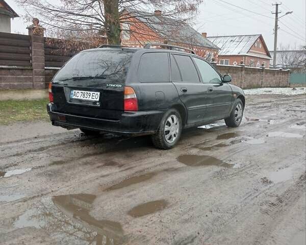 Чорний Міцубісі Lancer, об'ємом двигуна 2 л та пробігом 166 тис. км за 1699 $, фото 3 на Automoto.ua