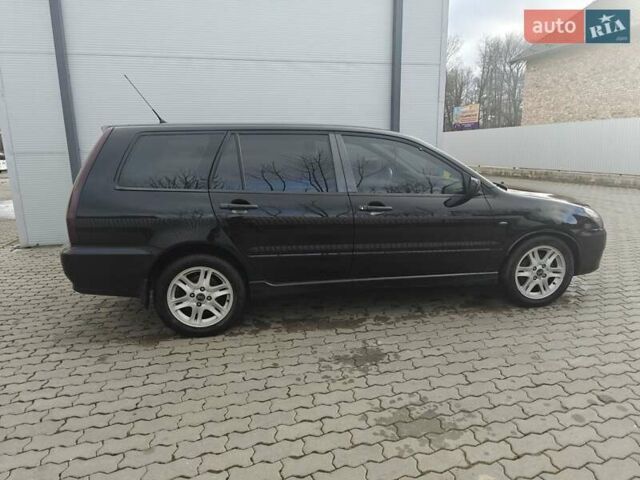 Черный Мицубиси Лансер, объемом двигателя 1.6 л и пробегом 591 тыс. км за 3300 $, фото 13 на Automoto.ua