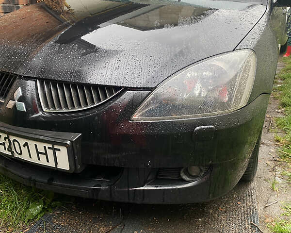 Чорний Міцубісі Lancer, об'ємом двигуна 2 л та пробігом 289 тис. км за 3600 $, фото 2 на Automoto.ua