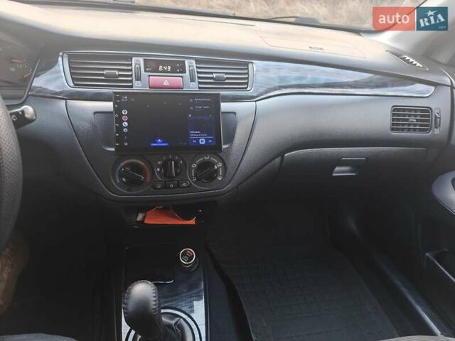 Черный Мицубиси Лансер, объемом двигателя 1.6 л и пробегом 591 тыс. км за 3300 $, фото 19 на Automoto.ua