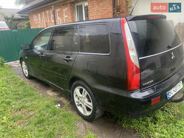 Чорний Міцубісі Lancer, об'ємом двигуна 2 л та пробігом 289 тис. км за 3600 $, фото 4 на Automoto.ua