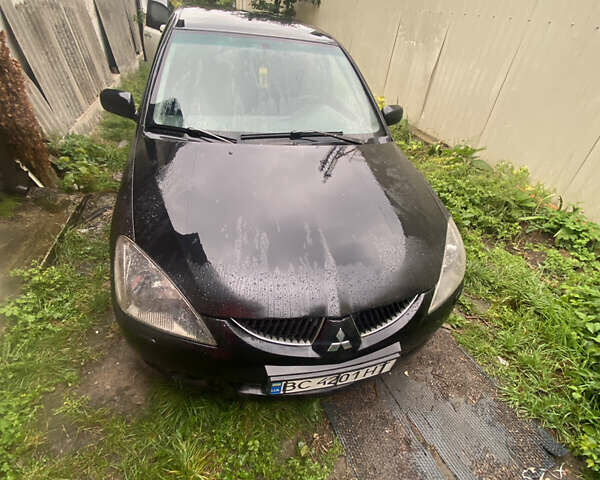 Чорний Міцубісі Lancer, об'ємом двигуна 2 л та пробігом 289 тис. км за 3600 $, фото 1 на Automoto.ua
