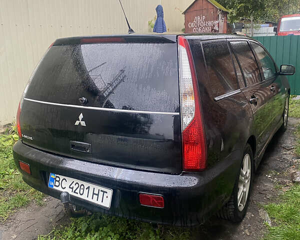 Чорний Міцубісі Lancer, об'ємом двигуна 2 л та пробігом 289 тис. км за 3600 $, фото 6 на Automoto.ua