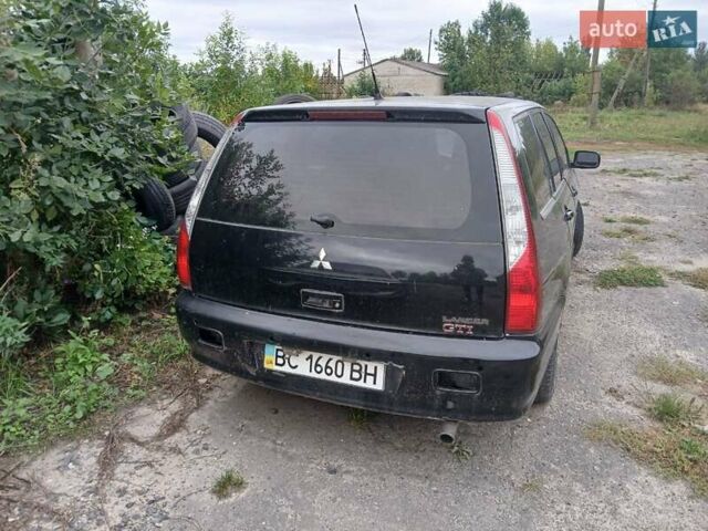 Чорний Міцубісі Lancer, об'ємом двигуна 2 л та пробігом 250 тис. км за 1850 $, фото 6 на Automoto.ua