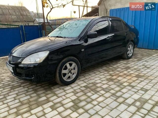 Чорний Міцубісі Lancer, об'ємом двигуна 1.6 л та пробігом 121 тис. км за 3900 $, фото 1 на Automoto.ua