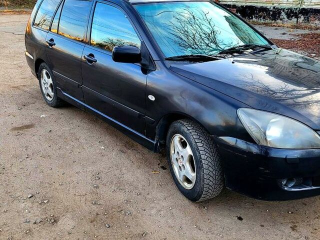 Чорний Міцубісі Lancer, об'ємом двигуна 1.6 л та пробігом 290 тис. км за 1999 $, фото 6 на Automoto.ua