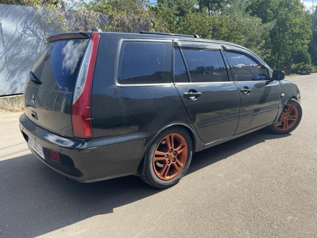 Черный Мицубиси Лансер, объемом двигателя 2 л и пробегом 175 тыс. км за 2850 $, фото 4 на Automoto.ua