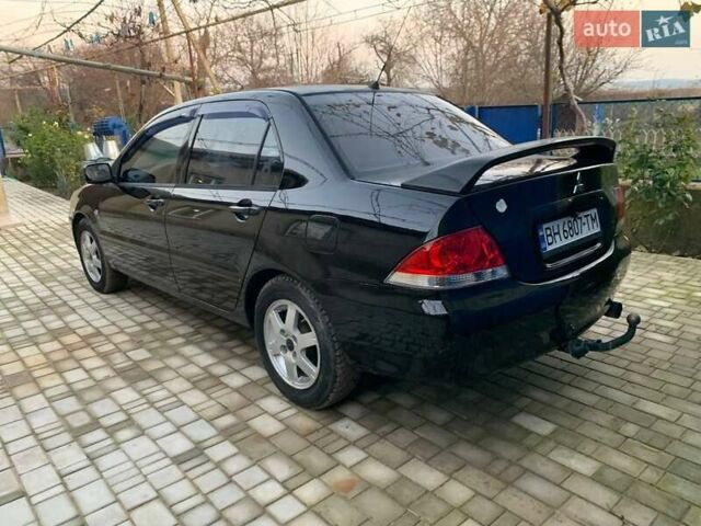 Чорний Міцубісі Lancer, об'ємом двигуна 1.6 л та пробігом 121 тис. км за 3900 $, фото 3 на Automoto.ua