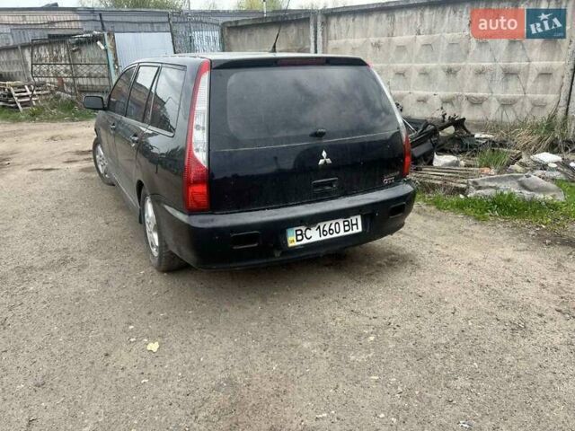 Чорний Міцубісі Lancer, об'ємом двигуна 2 л та пробігом 250 тис. км за 1850 $, фото 2 на Automoto.ua