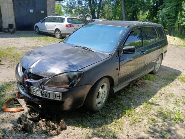Чорний Міцубісі Lancer, об'ємом двигуна 2 л та пробігом 200 тис. км за 2000 $, фото 3 на Automoto.ua
