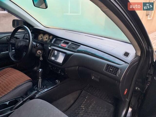 Чорний Міцубісі Lancer, об'ємом двигуна 1.6 л та пробігом 121 тис. км за 3900 $, фото 5 на Automoto.ua