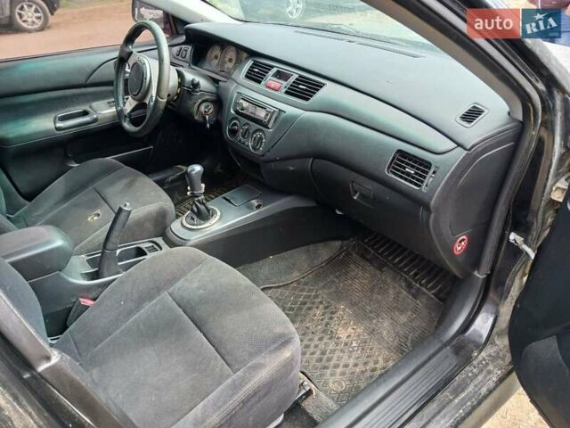 Чорний Міцубісі Lancer, об'ємом двигуна 2 л та пробігом 250 тис. км за 1850 $, фото 1 на Automoto.ua