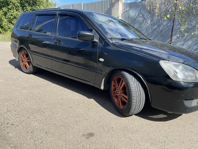 Черный Мицубиси Лансер, объемом двигателя 2 л и пробегом 175 тыс. км за 2850 $, фото 5 на Automoto.ua