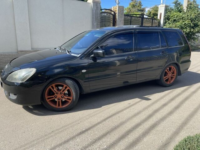 Черный Мицубиси Лансер, объемом двигателя 2 л и пробегом 175 тыс. км за 2850 $, фото 1 на Automoto.ua