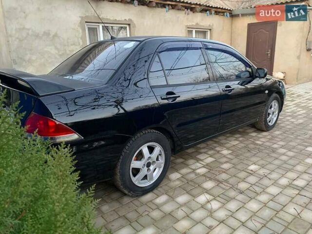 Чорний Міцубісі Lancer, об'ємом двигуна 1.6 л та пробігом 121 тис. км за 3900 $, фото 4 на Automoto.ua