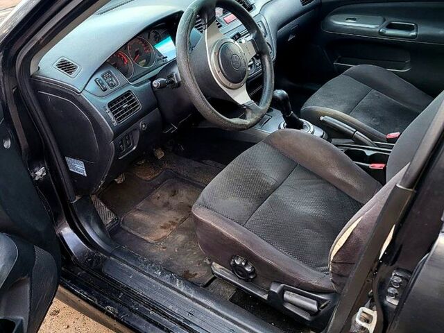 Чорний Міцубісі Lancer, об'ємом двигуна 1.6 л та пробігом 290 тис. км за 1999 $, фото 2 на Automoto.ua