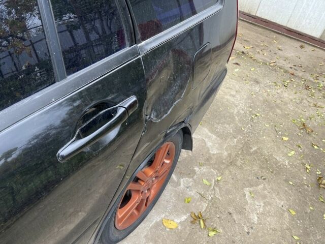 Черный Мицубиси Лансер, объемом двигателя 2 л и пробегом 175 тыс. км за 2850 $, фото 11 на Automoto.ua