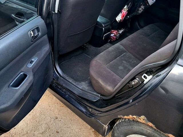 Чорний Міцубісі Lancer, об'ємом двигуна 1.6 л та пробігом 290 тис. км за 1999 $, фото 3 на Automoto.ua