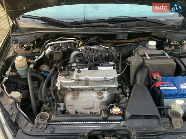 Чорний Міцубісі Lancer, об'ємом двигуна 1.6 л та пробігом 121 тис. км за 3900 $, фото 7 на Automoto.ua