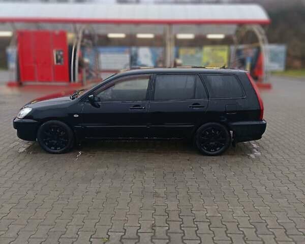 Черный Мицубиси Лансер, объемом двигателя 1.58 л и пробегом 336 тыс. км за 2600 $, фото 3 на Automoto.ua