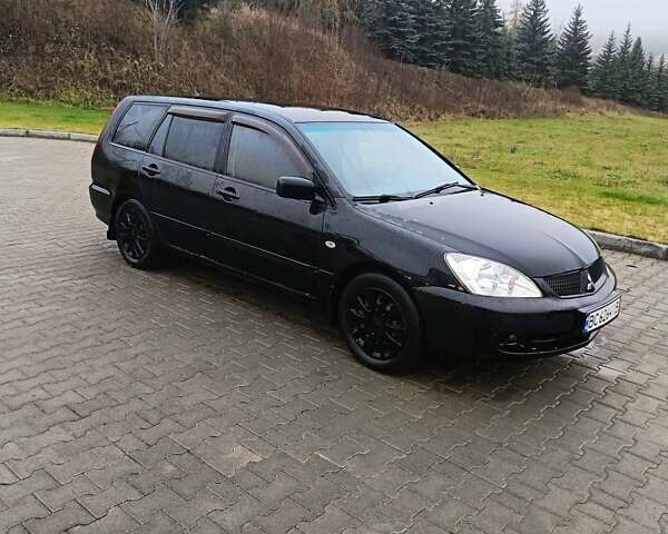 Черный Мицубиси Лансер, объемом двигателя 1.58 л и пробегом 336 тыс. км за 2600 $, фото 1 на Automoto.ua