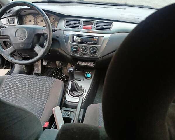 Черный Мицубиси Лансер, объемом двигателя 1.58 л и пробегом 336 тыс. км за 2600 $, фото 10 на Automoto.ua