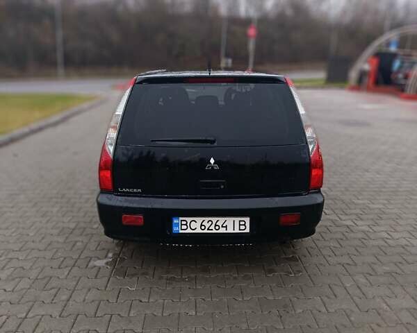 Черный Мицубиси Лансер, объемом двигателя 1.58 л и пробегом 336 тыс. км за 2600 $, фото 4 на Automoto.ua