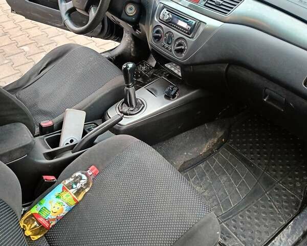 Черный Мицубиси Лансер, объемом двигателя 1.58 л и пробегом 336 тыс. км за 2600 $, фото 11 на Automoto.ua