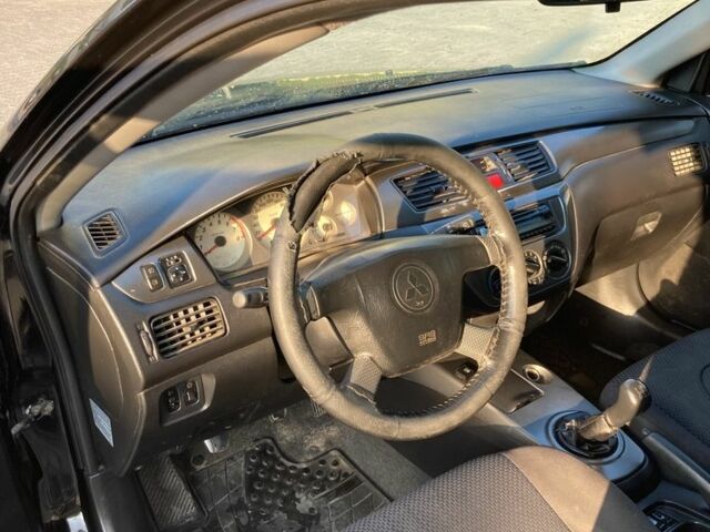 Чорний Міцубісі Lancer, об'ємом двигуна 1.6 л та пробігом 460 тис. км за 2349 $, фото 8 на Automoto.ua