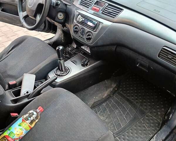 Черный Мицубиси Лансер, объемом двигателя 1.58 л и пробегом 336 тыс. км за 2600 $, фото 13 на Automoto.ua