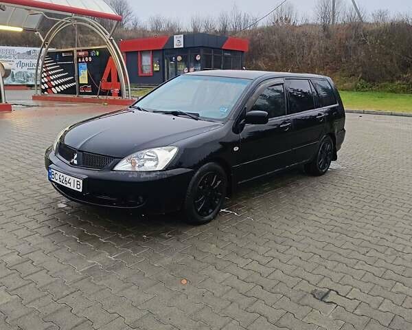 Черный Мицубиси Лансер, объемом двигателя 1.58 л и пробегом 336 тыс. км за 2600 $, фото 2 на Automoto.ua