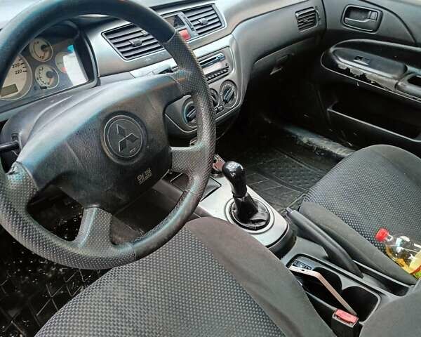 Черный Мицубиси Лансер, объемом двигателя 1.58 л и пробегом 336 тыс. км за 2600 $, фото 14 на Automoto.ua