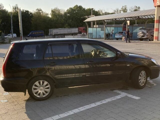 Чорний Міцубісі Lancer, об'ємом двигуна 1.6 л та пробігом 460 тис. км за 2349 $, фото 5 на Automoto.ua