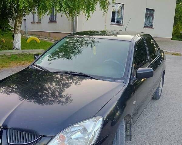 Чорний Міцубісі Lancer, об'ємом двигуна 1.58 л та пробігом 202 тис. км за 2800 $, фото 2 на Automoto.ua