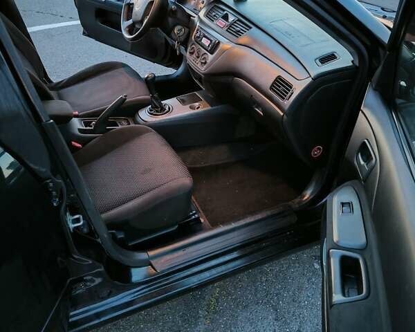 Міцубісі Lancer 2005 у Києві на Automoto.ua Чорний Міцубісі Lancer, об'ємом двигуна 1.6 л та пробігом 245 тис. км за 4000 $, фото 9 на Automoto.ua