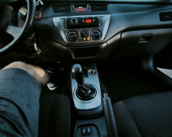 Міцубісі Lancer 2005 у Києві на Automoto.ua Чорний Міцубісі Lancer, об'ємом двигуна 1.6 л та пробігом 245 тис. км за 4000 $, фото 8 на Automoto.ua
