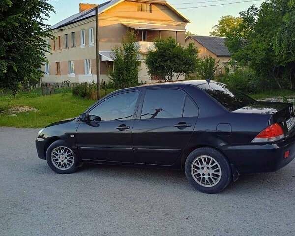 Чорний Міцубісі Lancer, об'ємом двигуна 1.58 л та пробігом 202 тис. км за 2800 $, фото 3 на Automoto.ua