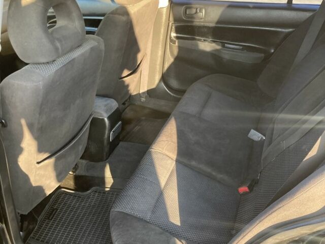 Чорний Міцубісі Lancer, об'ємом двигуна 1.6 л та пробігом 460 тис. км за 2349 $, фото 11 на Automoto.ua