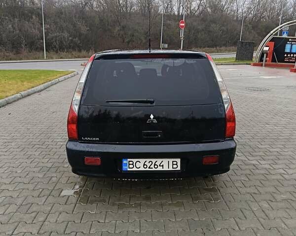 Черный Мицубиси Лансер, объемом двигателя 1.58 л и пробегом 336 тыс. км за 2600 $, фото 5 на Automoto.ua