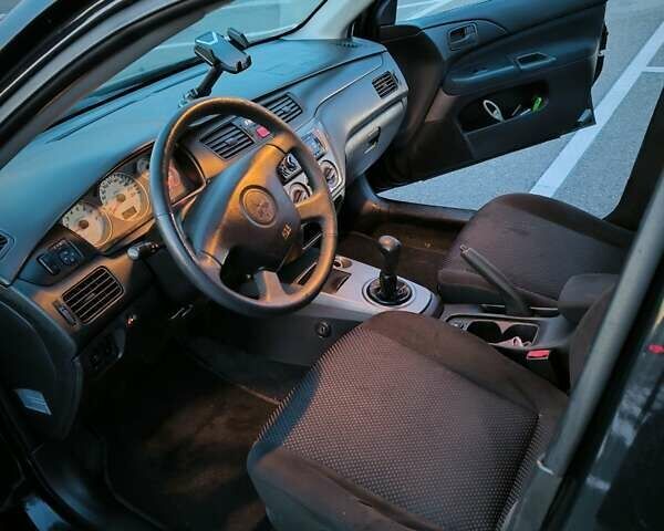 Міцубісі Lancer 2005 у Києві на Automoto.ua Чорний Міцубісі Lancer, об'ємом двигуна 1.6 л та пробігом 245 тис. км за 4000 $, фото 5 на Automoto.ua