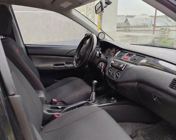 Чорний Міцубісі Lancer, об'ємом двигуна 1.58 л та пробігом 202 тис. км за 2800 $, фото 1 на Automoto.ua