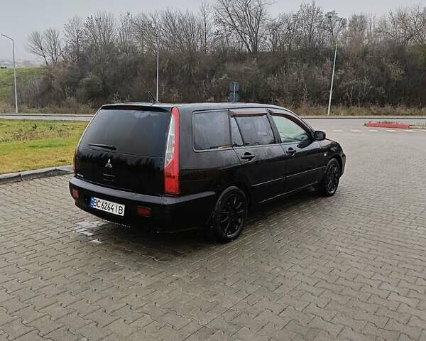 Черный Мицубиси Лансер, объемом двигателя 1.58 л и пробегом 336 тыс. км за 2600 $, фото 7 на Automoto.ua