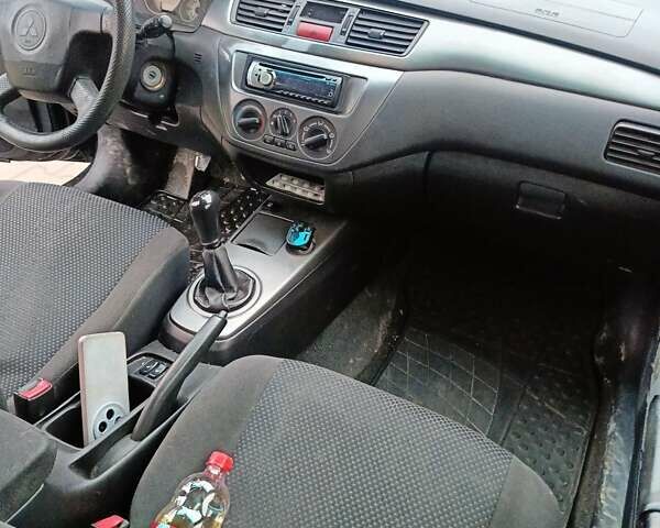 Черный Мицубиси Лансер, объемом двигателя 1.58 л и пробегом 336 тыс. км за 2600 $, фото 8 на Automoto.ua