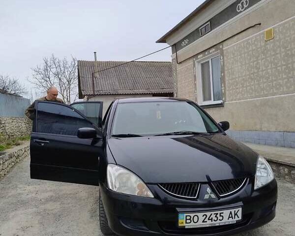 Чорний Міцубісі Lancer, об'ємом двигуна 1.58 л та пробігом 202 тис. км за 2800 $, фото 4 на Automoto.ua