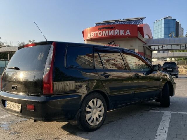 Чорний Міцубісі Lancer, об'ємом двигуна 1.6 л та пробігом 460 тис. км за 2349 $, фото 4 на Automoto.ua