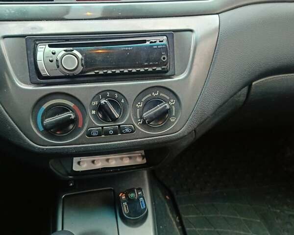 Черный Мицубиси Лансер, объемом двигателя 1.58 л и пробегом 336 тыс. км за 2600 $, фото 9 на Automoto.ua