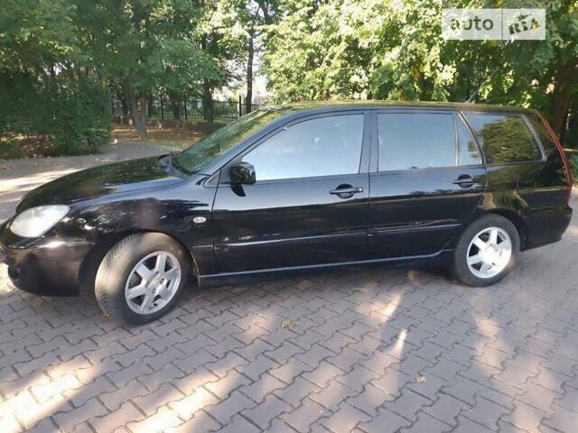 Чорний Міцубісі Lancer, об'ємом двигуна 1.6 л та пробігом 252 тис. км за 4900 $, фото 14 на Automoto.ua