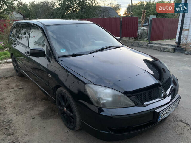 Черный Мицубиси Лансер, объемом двигателя 2 л и пробегом 212 тыс. км за 4500 $, фото 1 на Automoto.ua
