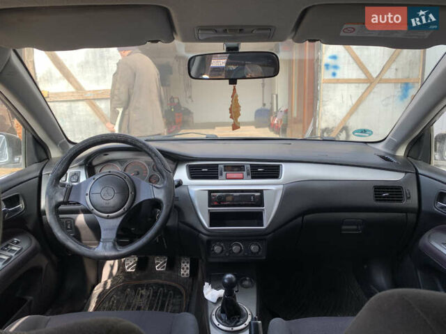 Черный Мицубиси Лансер, объемом двигателя 2 л и пробегом 212 тыс. км за 4500 $, фото 7 на Automoto.ua