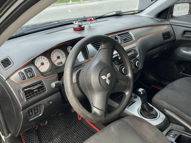 Чорний Міцубісі Lancer, об'ємом двигуна 1.6 л та пробігом 340 тис. км за 3500 $, фото 13 на Automoto.ua